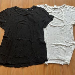 2 t-shirts with holes accents - reminiscent of IRO design